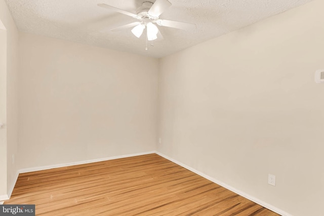 2053 Wintergreen Pl, Rosedale, MD 21237 - spare room featuring light wood-style floors, a ceiling fan, a textured ceiling, and baseboards