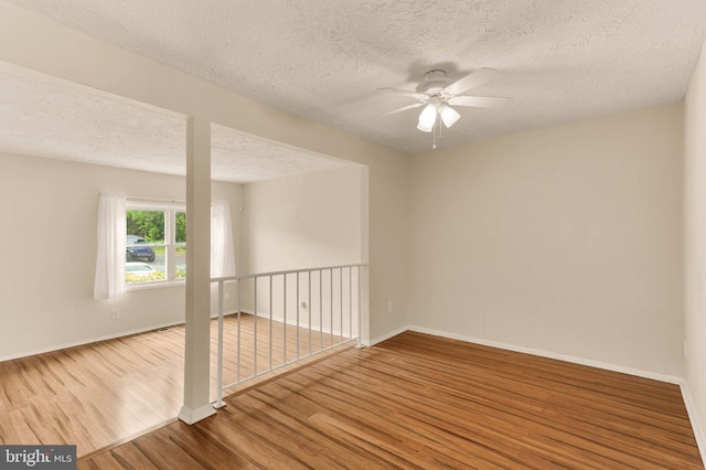 2053 Wintergreen Pl, Rosedale, MD 21237 - empty room featuring ceiling fan, wood finished floors, a textured ceiling, and baseboards
