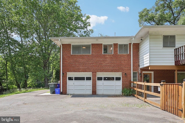 9307 Overlea Dr, Rockville, MD 20850 - view of front of home featuring asphalt driveway, a garage, and brick siding