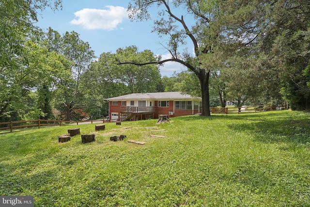 9307 Overlea Dr, Rockville, MD 20850 - view of yard featuring a wooden deck and view of wooded area