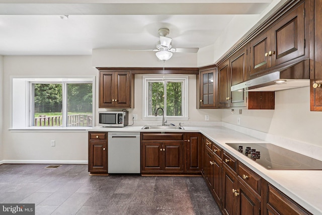 9307 Overlea Dr, Rockville, MD 20850 - kitchen featuring dishwasher, a sink, black electric cooktop, stainless steel microwave, and light countertops
