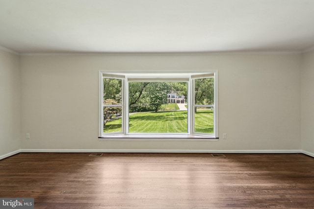 9307 Overlea Dr, Rockville, MD 20850 - unfurnished room with crown molding, wood finished floors, and baseboards