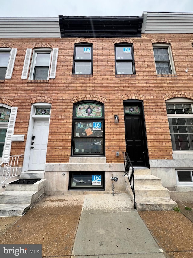 736 S Curley St, Baltimore, MD 21224 - townhome / multi-family property featuring brick siding