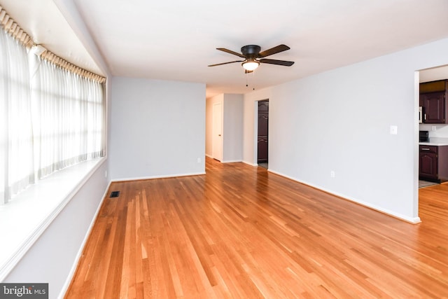 10903 Exeter Ct, Upper Marlboro, MD 20774 - empty room with ceiling fan, light wood-style flooring, and baseboards