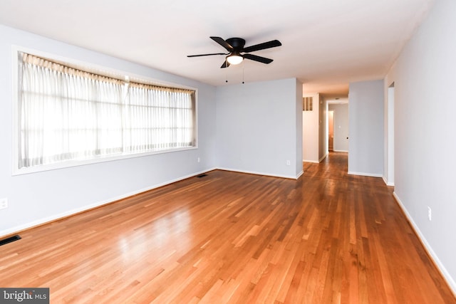10903 Exeter Ct, Upper Marlboro, MD 20774 - empty room featuring wood finished floors, ceiling fan, and baseboards