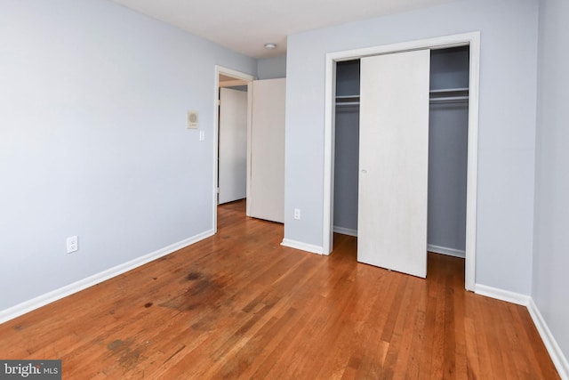 10903 Exeter Ct, Upper Marlboro, MD 20774 - unfurnished bedroom with wood finished floors, a closet, and baseboards