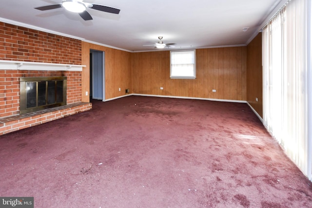 10903 Exeter Ct, Upper Marlboro, MD 20774 - unfurnished living room featuring ceiling fan, crown molding, carpet, baseboards, and a fireplace