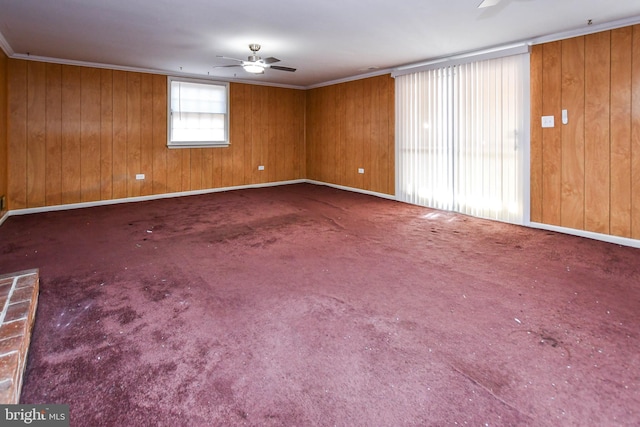 10903 Exeter Ct, Upper Marlboro, MD 20774 - spare room featuring a ceiling fan, wooden walls, carpet floors, baseboards, and ornamental molding