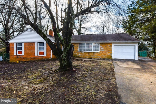 10903 Exeter Ct, Upper Marlboro, MD 20774 - view of front of home featuring a garage, a chimney, and concrete driveway