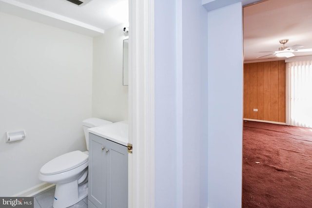 10903 Exeter Ct, Upper Marlboro, MD 20774 - half bath with toilet, vanity, baseboards, and wood walls
