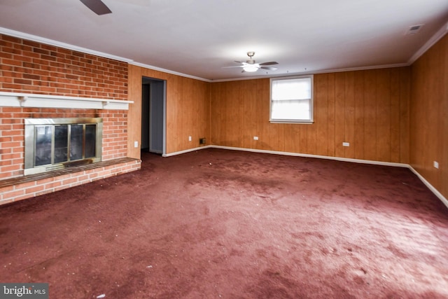 10903 Exeter Ct, Upper Marlboro, MD 20774 - unfurnished living room featuring a ceiling fan, crown molding, baseboards, carpet flooring, and wood walls