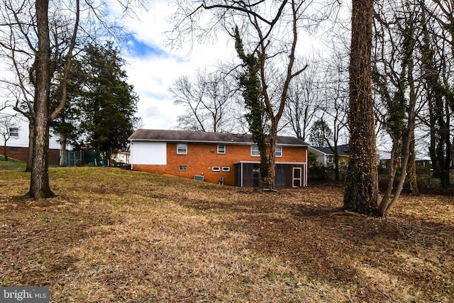 10903 Exeter Ct, Upper Marlboro, MD 20774 - rear view of house with brick siding and crawl space