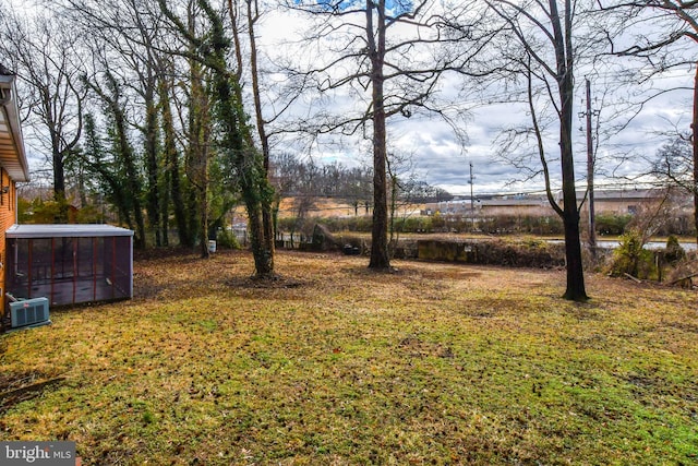 10903 Exeter Ct, Upper Marlboro, MD 20774 - view of grassy yard featuring central AC and a sunroom