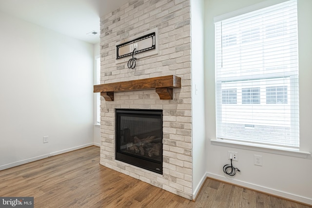4005 Sweet Azalea Row, Glen Allen, VA 23059 - unfurnished living room with a fireplace, wood finished floors, and baseboards