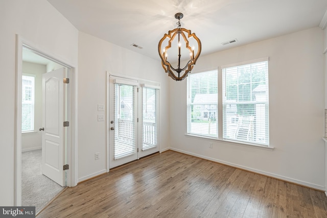 4005 Sweet Azalea Row, Glen Allen, VA 23059 - empty room featuring wood-type flooring, a chandelier, healthy amount of natural light, and baseboards