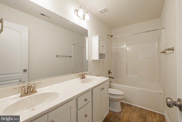 4005 Sweet Azalea Row, Glen Allen, VA 23059 - full bathroom with double vanity, toilet, wood finished floors, and  shower combination