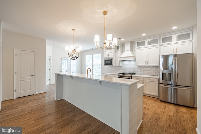 4005 Sweet Azalea Row, Glen Allen, VA 23059 - kitchen with appliances with stainless steel finishes, custom exhaust hood, a chandelier, light wood-type flooring, and white cabinets