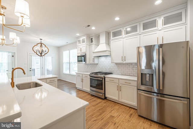 4005 Sweet Azalea Row, Glen Allen, VA 23059 - kitchen with stainless steel appliances, a sink, custom range hood, a chandelier, and light wood-style floors