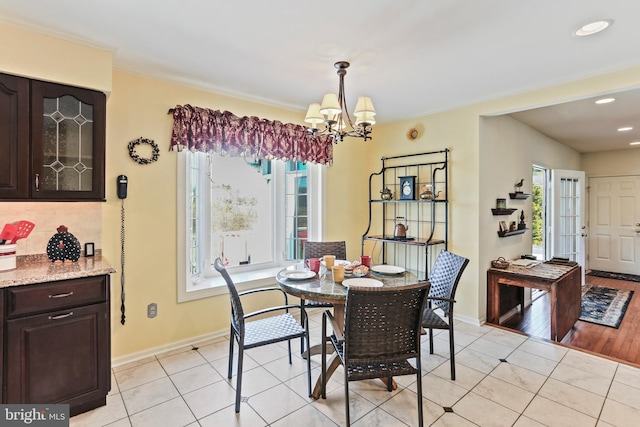 5512 Aspen Dale Ct, Ellicott City, MD 21043 - dining room with a chandelier, baseboards, light tile patterned flooring, and recessed lighting