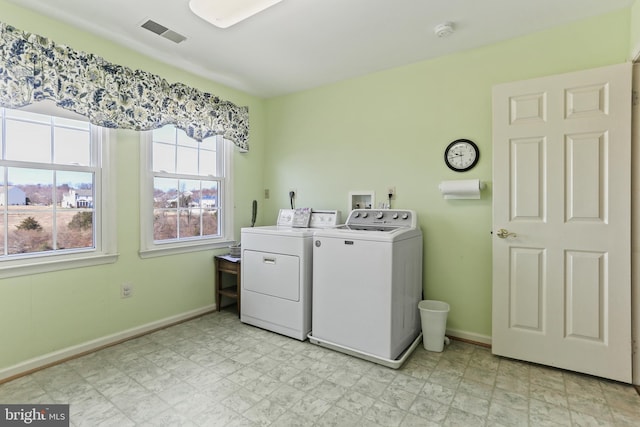 5512 Aspen Dale Ct, Ellicott City, MD 21043 - washroom with washing machine and dryer, plenty of natural light, and baseboards