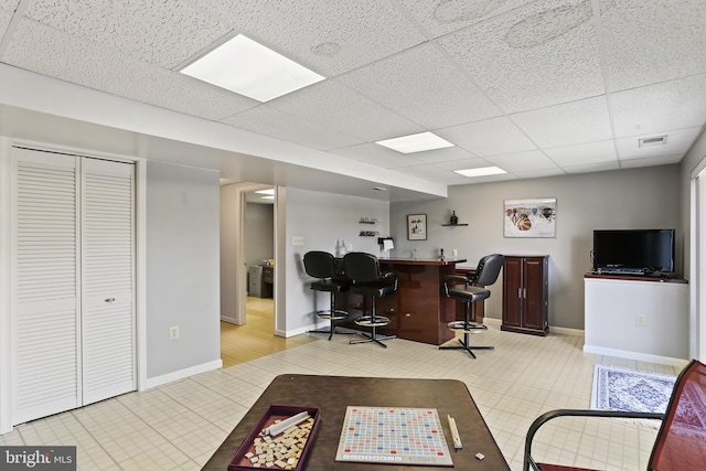 5512 Aspen Dale Ct, Ellicott City, MD 21043 - office area with wet bar, a paneled ceiling, baseboards, and light tile patterned flooring