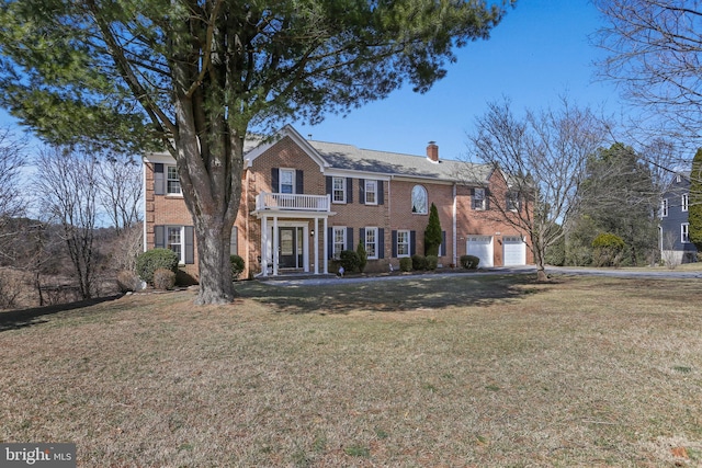 5512 Aspen Dale Ct, Ellicott City, MD 21043 - colonial inspired home with brick siding, a chimney, a front yard, and an attached garage