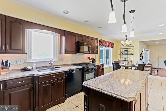 5512 Aspen Dale Ct, Ellicott City, MD 21043 - kitchen with a sink, black appliances, light tile patterned floors, a chandelier, and pendant lighting