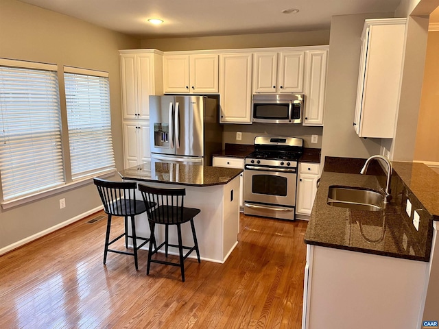2733 Aldersgate Way, Charlottesville, VA 22911 - kitchen featuring stainless steel appliances, a sink, white cabinets, dark wood-style floors, and recessed lighting