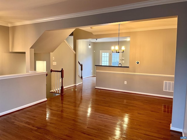 2733 Aldersgate Way, Charlottesville, VA 22911 - empty room featuring wood finished floors, a chandelier, ornamental molding, and baseboards