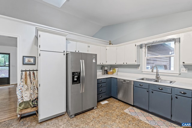 6 Axle Tree Rd, Palmyra, VA 22963 - kitchen with stainless steel appliances, a sink, lofted ceiling, white cabinets, and light countertops