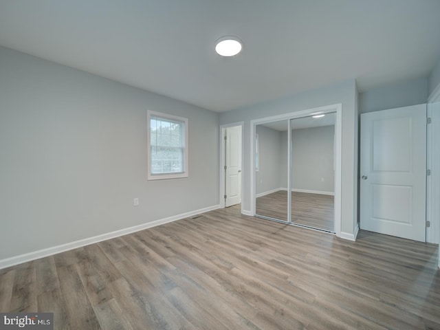 625 Butler Ave, Winchester, VA 22601 - unfurnished bedroom featuring wood finished floors, a closet, and baseboards