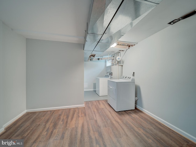 625 Butler Ave, Winchester, VA 22601 - washroom featuring washer and clothes dryer, wood finished floors, baseboards, and gas water heater