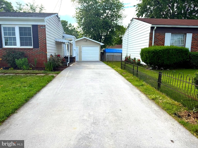 625 Butler Ave, Winchester, VA 22601 - view of home's exterior featuring brick siding, an outdoor structure, a garage, and asphalt driveway