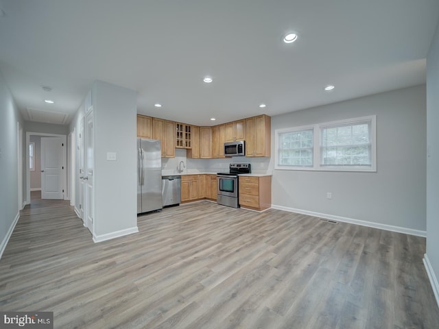 625 Butler Ave, Winchester, VA 22601 - kitchen with stainless steel appliances, baseboards, light wood-style flooring, light countertops, and recessed lighting
