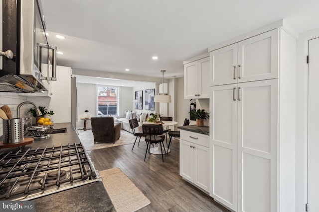 106 Bainbridge St, Philadelphia, PA 19147 - kitchen with stovetop, a sink, recessed lighting, dark countertops, and dark wood-type flooring
