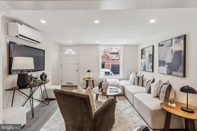 106 Bainbridge St, Philadelphia, PA 19147 - living room with an AC wall unit, light wood finished floors, and recessed lighting