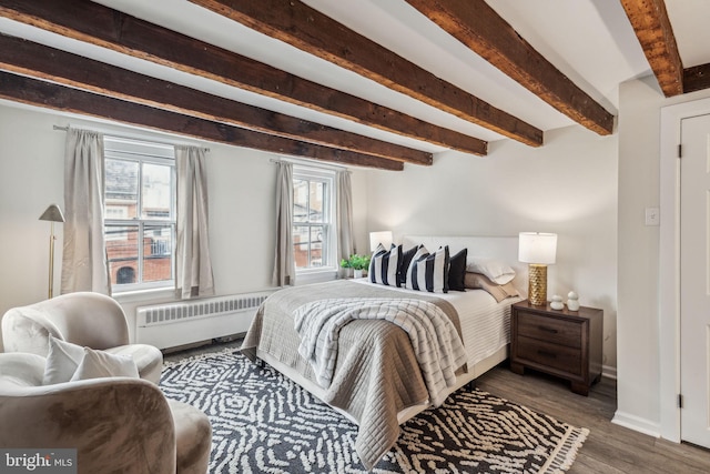 106 Bainbridge St, Philadelphia, PA 19147 - bedroom featuring radiator heating unit, beam ceiling, wood finished floors, and baseboards