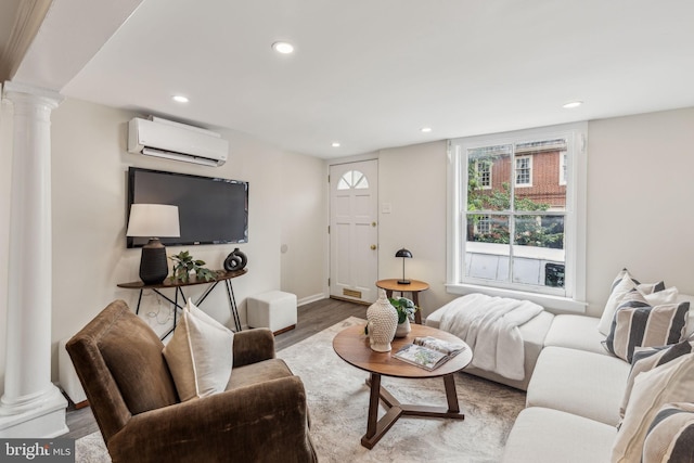 106 Bainbridge St, Philadelphia, PA 19147 - living room with decorative columns, a wall mounted air conditioner, recessed lighting, wood finished floors, and baseboards