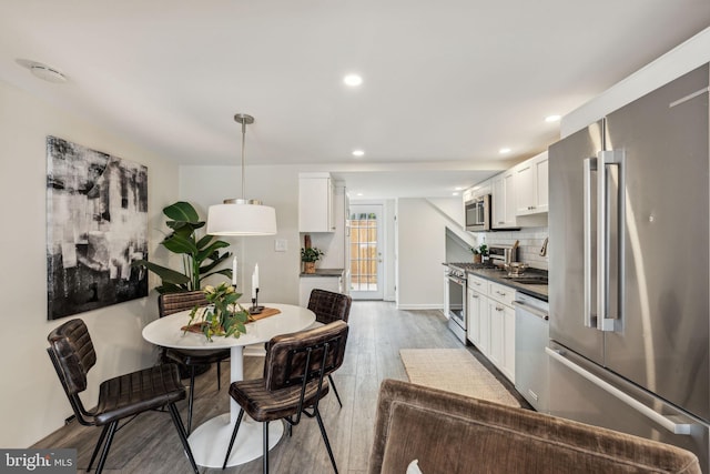 106 Bainbridge St, Philadelphia, PA 19147 - dining area featuring wood finished floors, recessed lighting, and baseboards