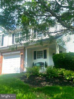 812 Red Rock Cir, Royersford, PA 19468 - view of front of property featuring brick siding, covered porch, and a garage
