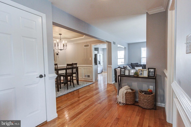 812 Red Rock Cir, Royersford, PA 19468 - hall with light wood finished floors, a chandelier, and ornamental molding