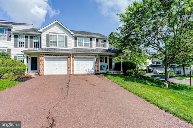812 Red Rock Cir, Royersford, PA 19468 - multi unit property featuring driveway, brick siding, a garage, a front yard, and a shingled roof