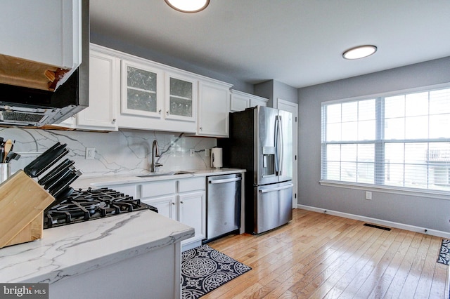 812 Red Rock Cir, Royersford, PA 19468 - kitchen featuring stainless steel appliances, baseboards, white cabinets, and decorative backsplash