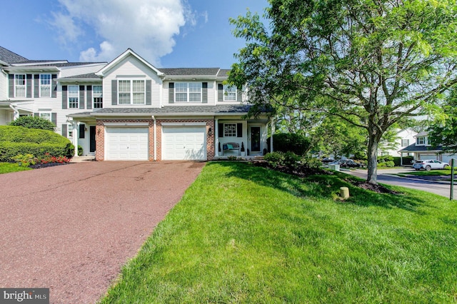 812 Red Rock Cir, Royersford, PA 19468 - townhome / multi-family property with asphalt driveway, an attached garage, brick siding, a front lawn, and roof with shingles