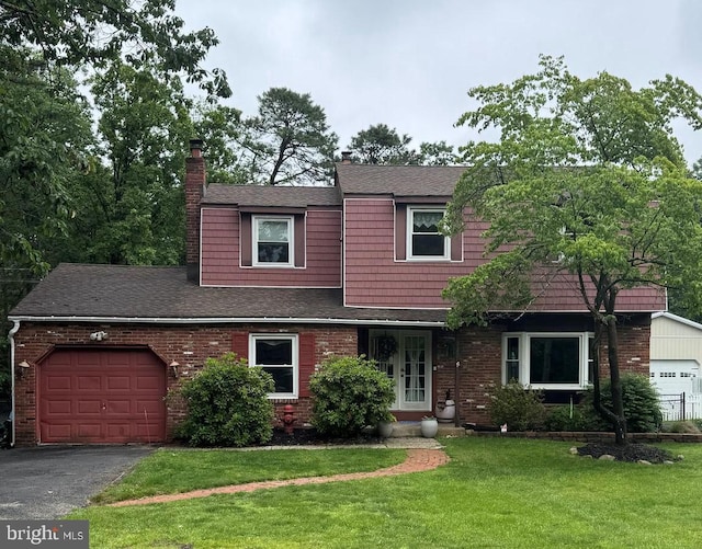 312 Walnut Ave, Marlton, NJ 08053 - view of front of property with a garage, brick siding, a front yard, roof with shingles, and a chimney