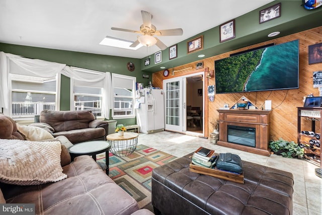 312 Walnut Ave, Marlton, NJ 08053 - tiled living area with a ceiling fan and wood walls