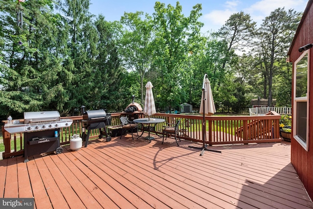 312 Walnut Ave, Marlton, NJ 08053 - deck featuring area for grilling, view of wooded area, and outdoor dining area