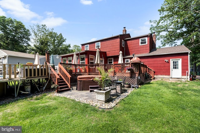 312 Walnut Ave, Marlton, NJ 08053 - back of property with a hot tub, a deck, a chimney, a patio, and a yard