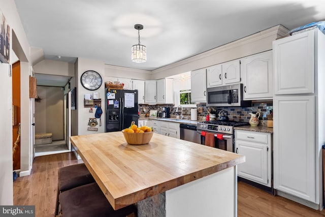 312 Walnut Ave, Marlton, NJ 08053 - kitchen with stainless steel appliances, a sink, white cabinets, backsplash, and wooden counters