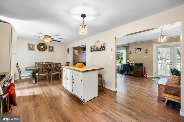 312 Walnut Ave, Marlton, NJ 08053 - kitchen featuring wooden counters, light wood-style flooring, white cabinets, stainless steel range with gas stovetop, and an office area